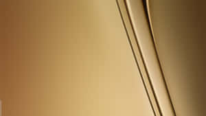 A Gold Background With A Curved Line Wallpaper