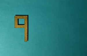 A Gold Letter P On A Turquoise Background Wallpaper