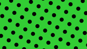 A Green Background With Black Dots Wallpaper