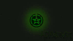 A Green Logo With A Black Background Wallpaper