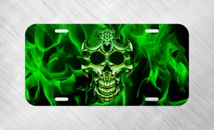A Green Skull With Flames On A Black Background Wallpaper