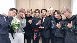 A Group Of K-pop Boys Posing For A Picture Wallpaper