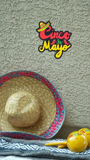 A Hat And A Tequila Bottle On A Table Wallpaper