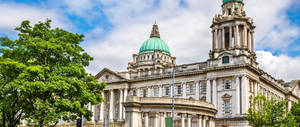 A Large Building With A Green Dome On Top Wallpaper