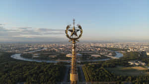 A Large City With A Large Tower Wallpaper