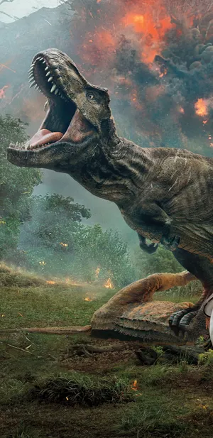 A Life-like Dinosaur Roams Through The Dark Night Wallpaper