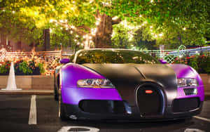 A Luminous Bugatti Illuminated In The Night Sky Wallpaper