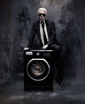 A Man In A Suit Sitting On A Washing Machine Wallpaper