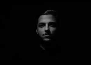 A Man In Black With His Eyes Closed Wallpaper