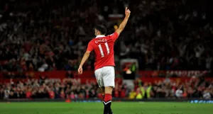 A Man In Red Shirt Is Celebrating His Goal Wallpaper