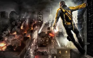 A Man Is Standing On A Rooftop With A Fire In His Hands Wallpaper