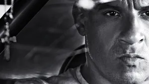 A Man Is Staring At The Camera In A Car Wallpaper