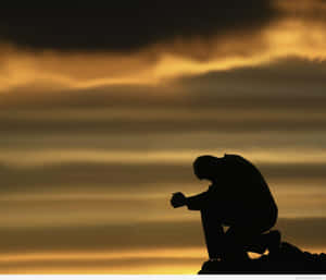 A Man Kneeling Down Wallpaper