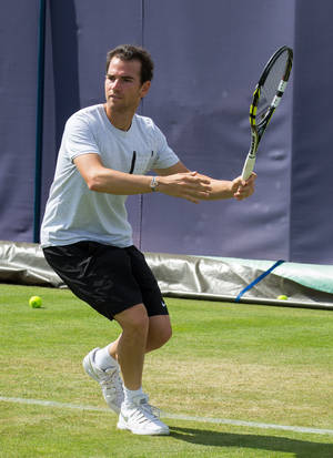 A Man Playing Tennis Wallpaper