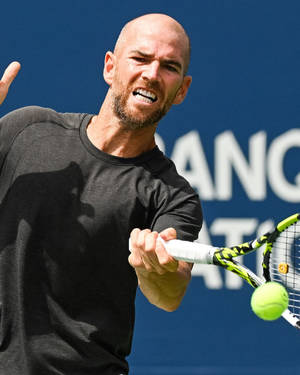 A Man Playing Tennis Wallpaper