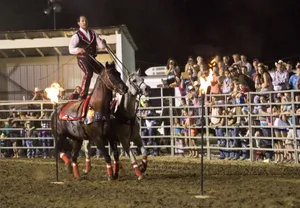 A Man Riding A Horse With A Fire In His Mouth Wallpaper