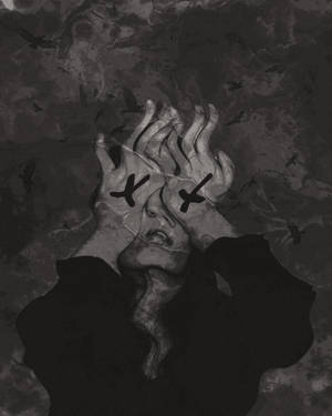 A Man Sits, Deep In Thought And Feeling A Sad Emotion Wallpaper