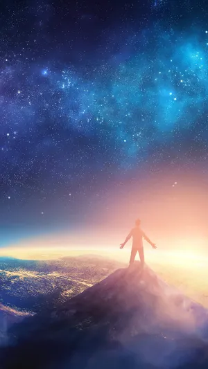 A Man Standing Atop A Mountain Peak, Enjoying The Beautiful View Wallpaper