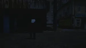 A Man Standing In A Dark Street Wallpaper