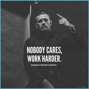 A Man With A Ring On His Hand With The Words Nobody Cares Work Harder Wallpaper