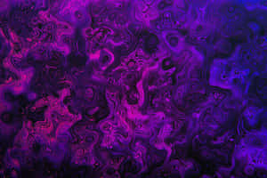 A Modern Purple Laptop On A Desk Wallpaper