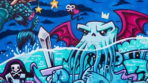A Multi-colored Painting Adorns This Graffiti Wall. Wallpaper