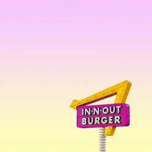 A Neon Sign With A Yellow And Pink Background Wallpaper