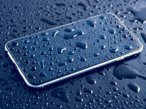 A Phone With Water Drops On It Wallpaper