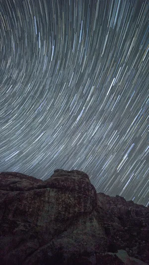 A Picturesque Time Lapse Of Clouds And Stars Wallpaper