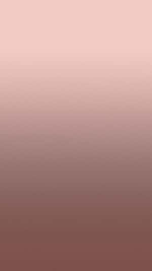 A Pink And Brown Gradient Wallpaper Wallpaper