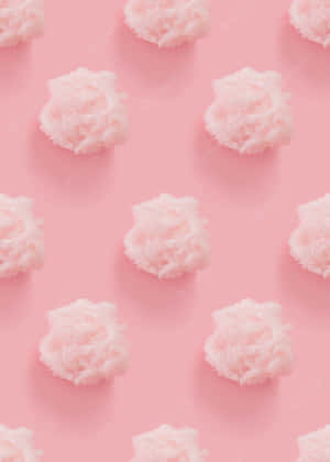 A Pink Background With White Clouds On It Wallpaper