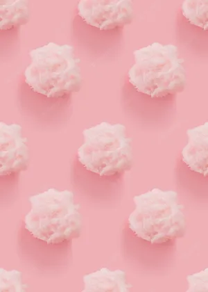 A Pink Background With White Clouds On It Wallpaper