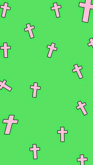 A Pink Cross Pattern On A Green Background Wallpaper