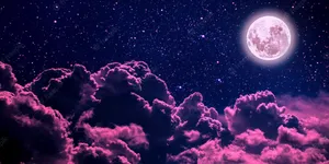 A Pink Moon In The Sky With Clouds Wallpaper
