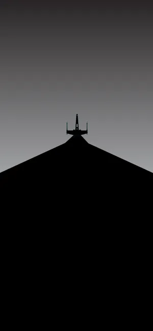 A Plane Is Silhouetted On A Runway Wallpaper