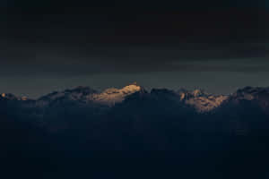 A Pristine Shoreline With Crystal Clear Water Under A Calming Sky Wallpaper
