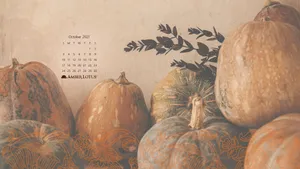 A Pumpkin Is Sitting On A Table Wallpaper