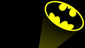 A Radiant Bat Signal Lighting Up The Night Sky Wallpaper