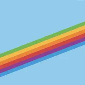 A Rainbow Of Color Emerges Against A Blue Sky Wallpaper