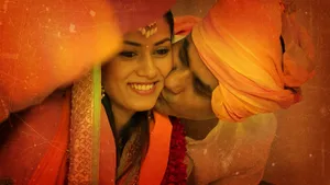 A Rajputana Romance - Man Kissing Woman In Traditional Attire Wallpaper