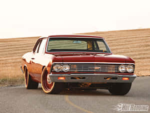 A Red Car On A Road Wallpaper