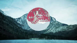 A Red Circle With Mountains In The Background Wallpaper