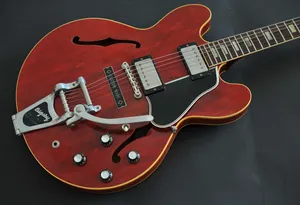 A Red Guitar With A Black Neck And A Black Body Wallpaper