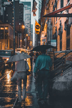 A Serene Moment Of Togetherness In The Rain Wallpaper