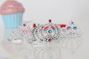 A Set Of Tiaras And Cupcakes On A Table Wallpaper