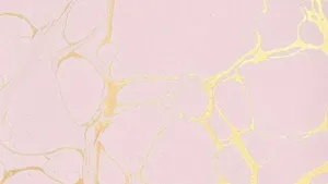 A Sleek And Stylish Rose Gold Laptop Perfect For Work And Play. Wallpaper