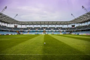 A Soccer Field With A Ball On It Wallpaper