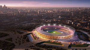 A Spectacular Sunset Visible Through The Stadium Of The Olympics Wallpaper