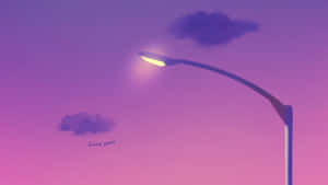 A Street Light With Clouds And A Purple Sky Wallpaper