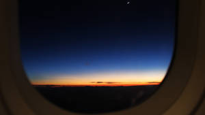 A Sunset View From A Plane Window Wallpaper